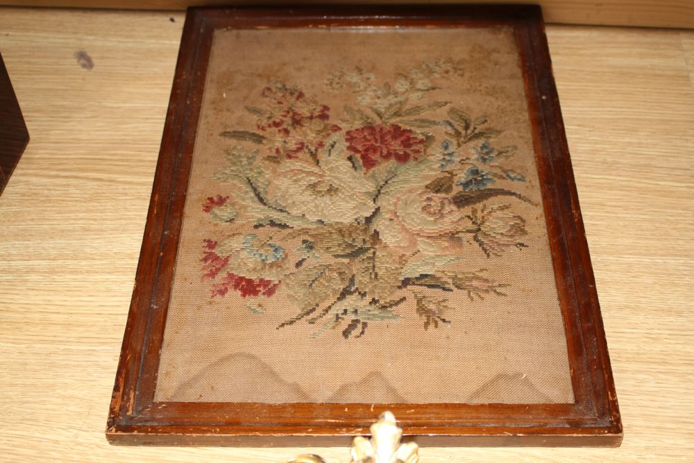 A gilt framed oil portrait of a young lady signed E. Reilly, diameter 22cm, overall 40cm, and two woolwork floral panels, 37 x 26cm